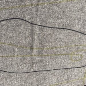 a close up of grey Cable & Blake fabric, with black and olive green lines meandering through it.