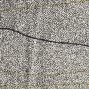 a close up of grey Cable & Blake fabric, with black and olive green lines meandering through it.